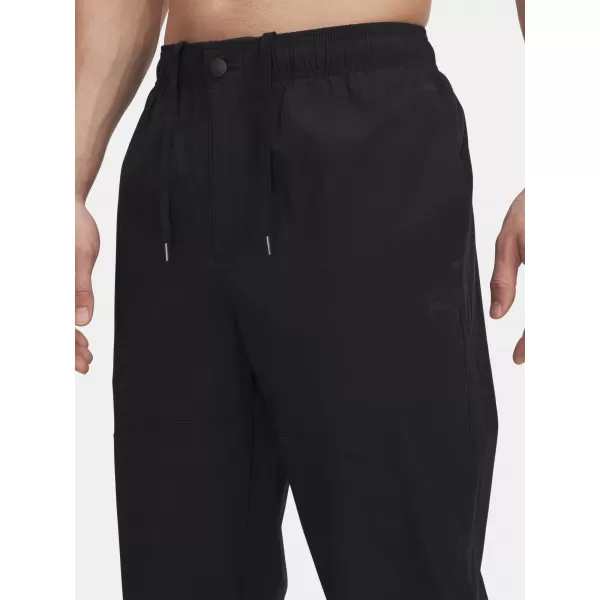  Férfi sportnadrág UNDER ARMOUR UA UNSTPBLE WOVEN TX TAPER 6003865-001 FEKETE 