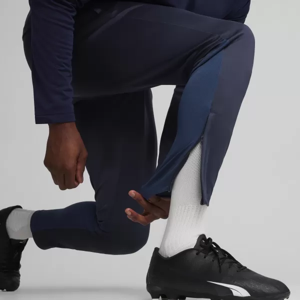  Nadrág PUMA TEAMGOAL TRAINING PANT 658639_06 PUMA NAVY/FEHÉR/PERZSA KÉK 