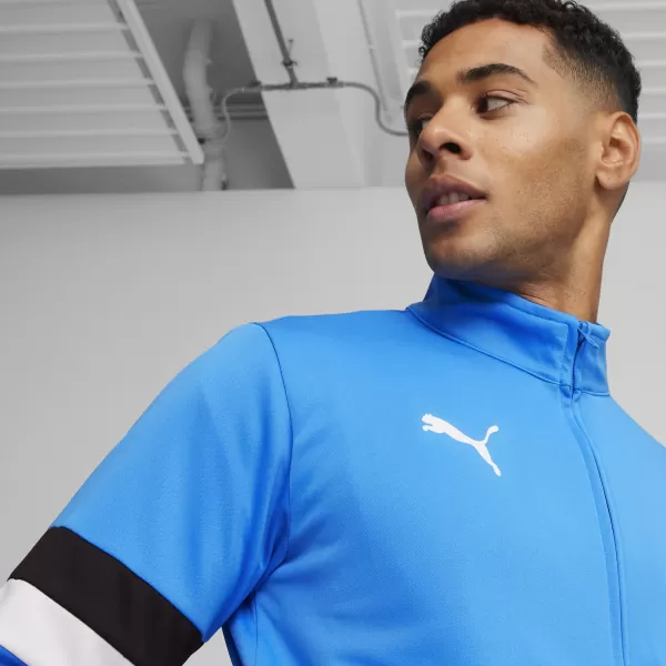  Férfi tréningruha szett PUMA TEAMRISE TRACKSUIT 658653_02 IGNITE BLUE/ KÉK/PUMAFEKETE GYÚJTÁS 