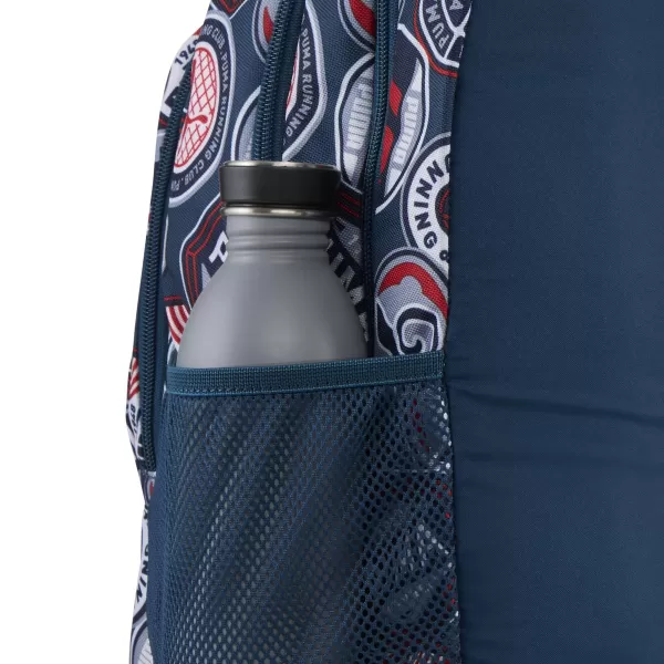  Hátizsák PUMA ACADEMY AOP BACKPACK 09115027 ÉJFÉLI BENZIN/MINDIG PIROS/FUTÓJELVÉNYEK AOP 