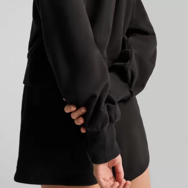  Női pulóver PUMA WARDROBE ESS RELAXED CROPPED HOODIE TR 629746-01 FEKETE 